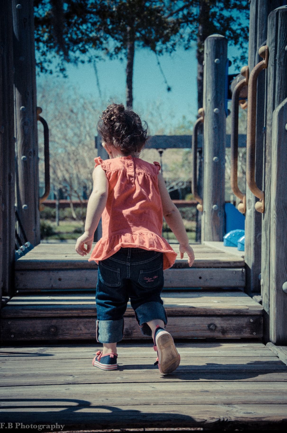 Young child on playground representing family legacy and generational impact